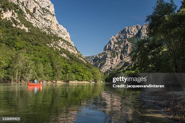 canoeing on the verdon river, provence, france - family red canoe stock pictures, royalty-free photos & images