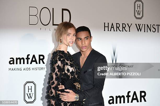 Russian model Sasha Luss and French fashion designer Olivier Rousteing pose as they arrive for the amfAR's 23rd Cinema Against AIDS Gala on May 19,...