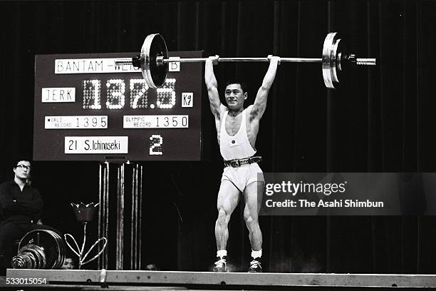 Shiro Ichinoseki of Japan competes in the Weightlifting Bantamweight during the Tokyo Summer Olympic Games at the Shibuya Kokaido Hall on October 11,...