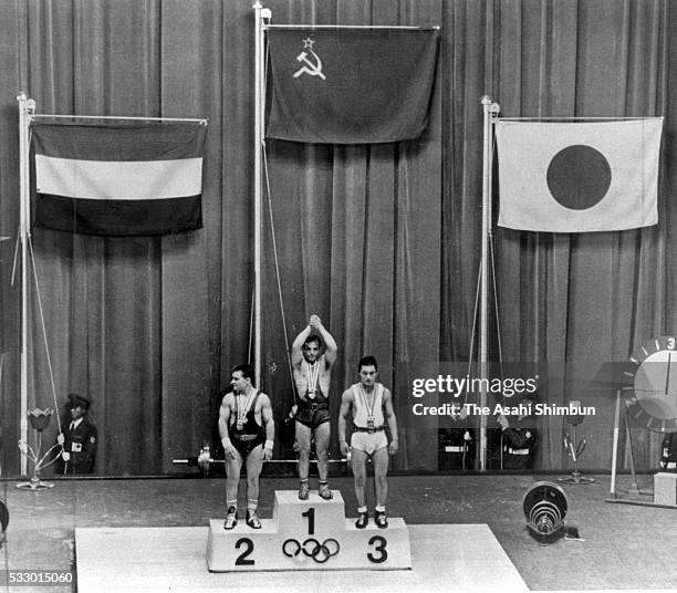 Gold Medalist Aleksey Vakhonin of Soviet Union, Silver Medalist Imre Foldi of Hungary and Bronze Medalist Shiro Ichinoseki of Japan pose on the...