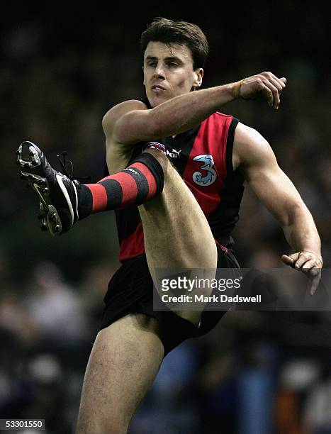 Matthew Lloyd for the Bombers kicks for goal during the AFL Round 18 match between the Essendon Bombers and the Geelong Cats at Telstra Dome July 29,...