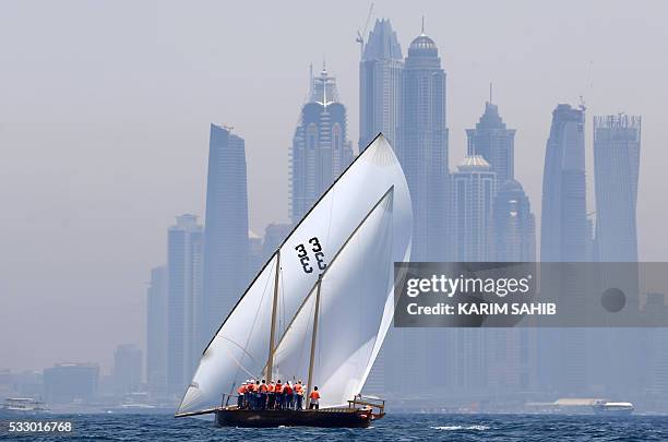 Emiratis sailors compete in the Al-Gaffal traditional long-distance dhow sailing race between the island of Sir Bu Nair, near the Iranian coast, and...