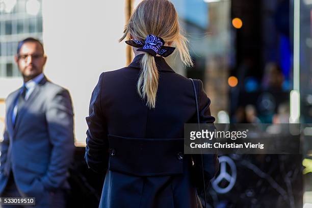 Natalie Cantell wearing a black blazer, clutch, bandana in her hair and white button shirt and Ray Ban sunglasses at Mercedes-Benz Fashion Week...