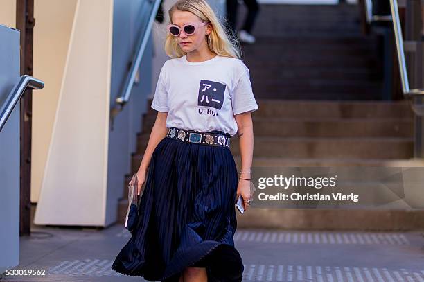 Guest wearing a white tshirt and black skirt and belt at Mercedes-Benz Fashion Week Resort 17 Collections at Carriageworks on May 20, 2016 in Sydney,...