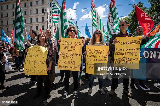 Teachers shout slogans and wave flags outside the Minister of Education, Universities and Research to demand the renewal of contracts in Rome, Italy...