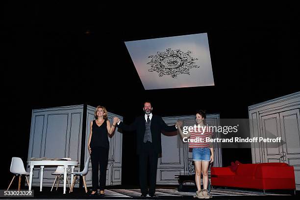 Actors Corinne Touzet, Christian Vadim and Fanny Guillot acknowledge the applause of the audience at the end of the 100th representation of the...