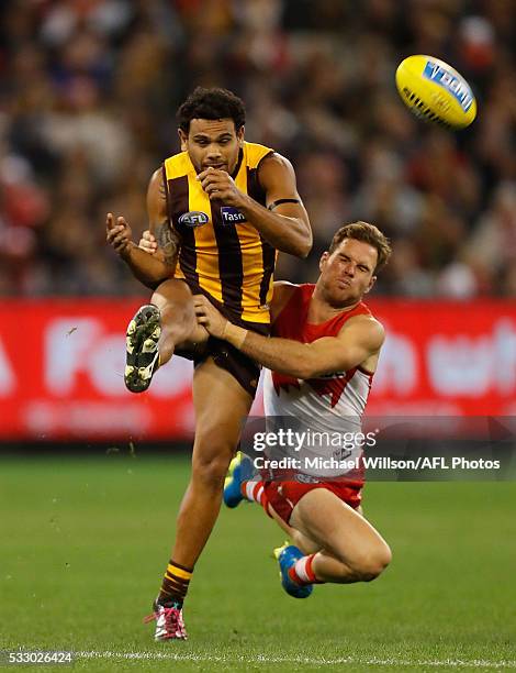 Cyril Rioli of the Hawks is tackled by Ben McGlynn of the Swans during the 2016 AFL Round 09 match between the Hawthorn Hawks and the Sydney Swans at...