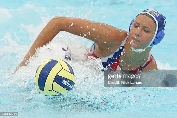Johanne Begin of Canada is held down by Galina Zlotnikova of Russia in the bronze medal match during the XI FINA World Championships at the Parc...