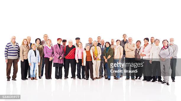 large group of happy seniors. - large group of people white background stock pictures, royalty-free photos & images