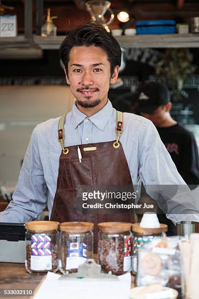 Owner and barista of specialty coffee shop Onibus Coffee Atsushi Sakao poses for a photograph on May 20, 2016 in Tokyo, Japan. With the rise of...