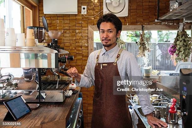 Owner and barista of specialty coffee shop Onibus Coffee Atsushi Sakao poses for a photograph on May 20, 2016 in Tokyo, Japan. With the rise of...