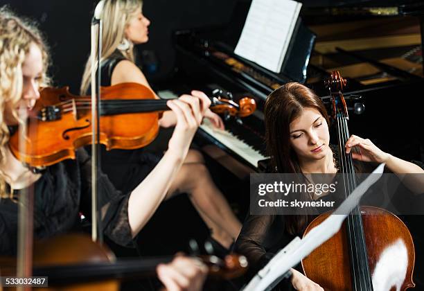 trio orchestra. - violin stock pictures, royalty-free photos & images