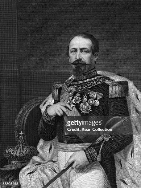 Portrait of French dictator Napoleon III , emperor of France , in full dress uniform holding a sword and displaying his many medals, 1873.