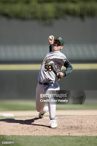 Justin Duchscherer of the Oakland Athletics delivers a pitch during the game against the Chicago White Sox at U.S. Cellular Field on July 10, 2005 in...