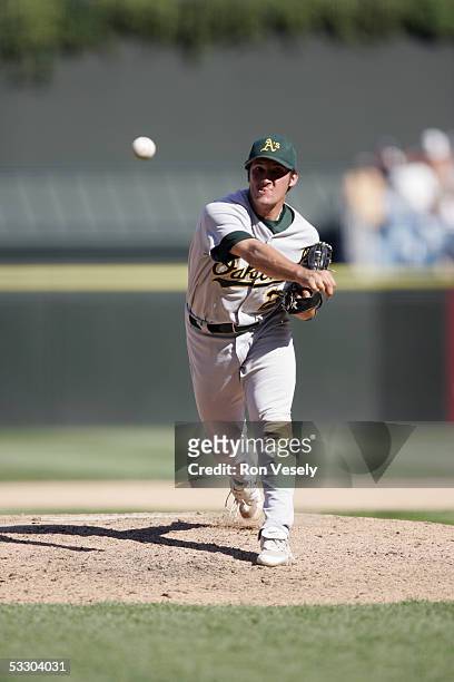 Huston Street of the Oakland Athletics delivers a pitch during the game against the Chicago White Sox at U.S. Cellular Field on July 10, 2005 in...