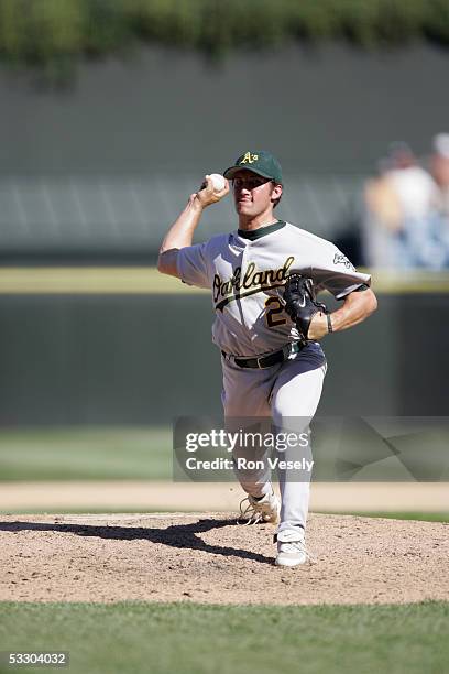 Huston Street of the Oakland Athletics delivers a pitch during the game against the Chicago White Sox at U.S. Cellular Field on July 10, 2005 in...