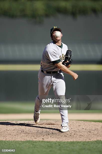 Huston Street of the Oakland Athletics delivers a pitch during the game against the Chicago White Sox at U.S. Cellular Field on July 10, 2005 in...