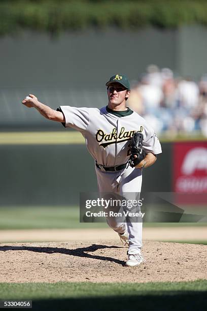 Huston Street of the Oakland Athletics delivers a pitch during the game against the Chicago White Sox at U.S. Cellular Field on July 10, 2005 in...