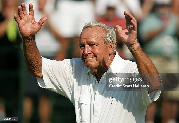 Arnold Palmer of the USA waves to the gallery as he walks off the 18th green during the second round of the U.S. Senior Open at the NCR Country Club...