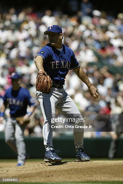 Kenny Rogers of the Texas Rangers pitches against the Seattle Mariners during the game on July 3, 2005 at Safeco Field in Seattle, Washington. The...