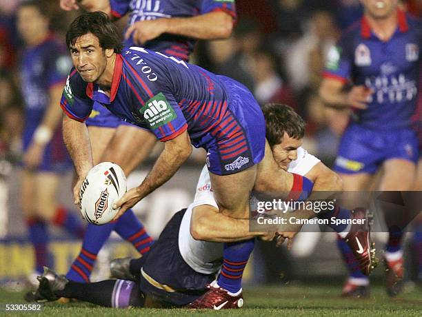 Newcastle Captain Andrew Johns passes the ball during the Round 21 NRL match between the Newcastle Knights and the Melbourne Storm at Energy...