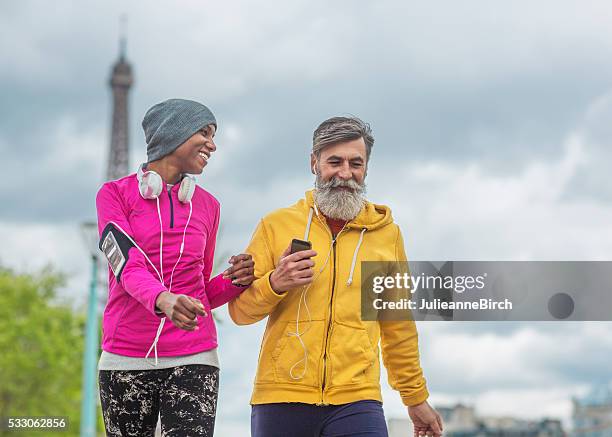 friends walking around paris - paris sport stock pictures, royalty-free photos & images