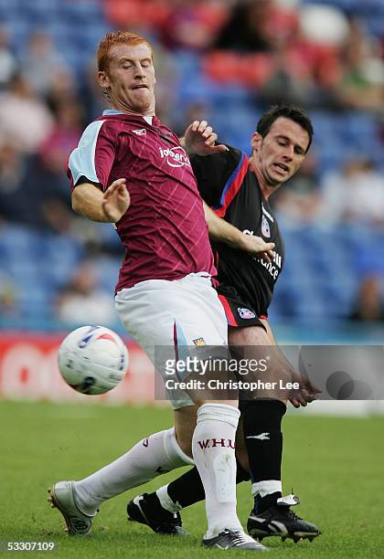 James Collins of West Ham and Dougie Freedman of Crystal Palace battle for the ball during the pre-season friendly match between Crystal Palace and...