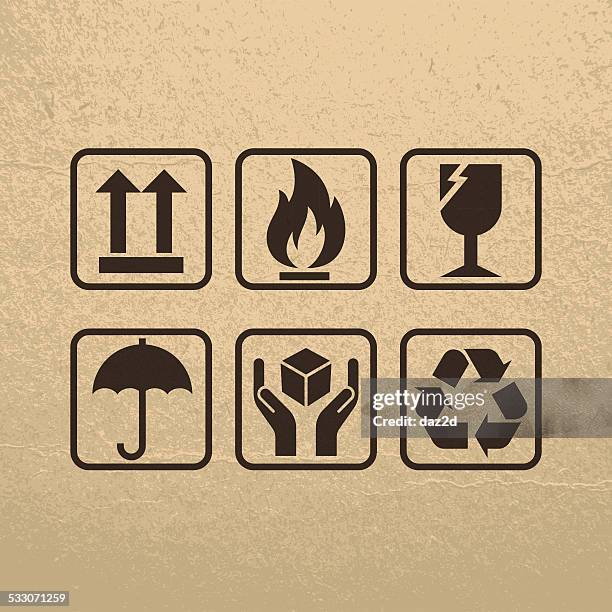 zerbrechlich symbole auf braunes papier textur - surface level stock-grafiken, -clipart, -cartoons und -symbole