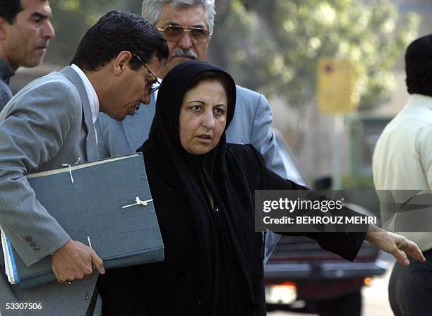 Picture dated 18 July 2004 shows Abdolfattah Soltani speaking with his colleague, the Nobel Prize winning Iranian human rights lawyer Shirin Ebadi ,...