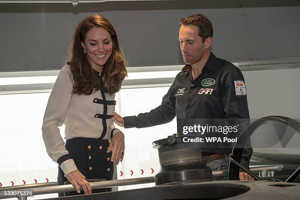 Catherine, Duchess of Cambridge, patron of the 1851 Trust, talks with Sir Ben Ainslie as she visits the Land Rover BAR team, who are challenging for...