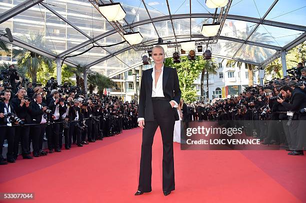 South African-US actress Charlize Theron poses as she arrives on May 20, 2016 for the screening of the film "The Last Face" at the 69th Cannes Film...