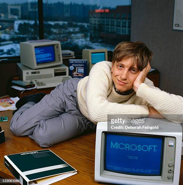 Deborah Feingold/Corbis via Getty Images) Bill Gates, CEO of Microsoft, reclines on his desk in his office soon after the release of Windows 1.0.