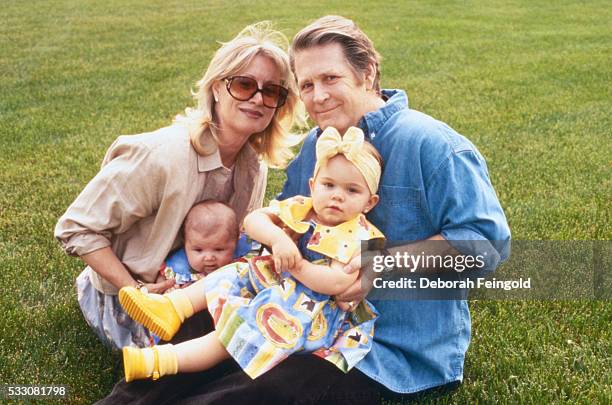 Deborah Feingold/Corbis via Getty Images) Brian Wilson with Wife Melinda and Daughters Delanie and Daria