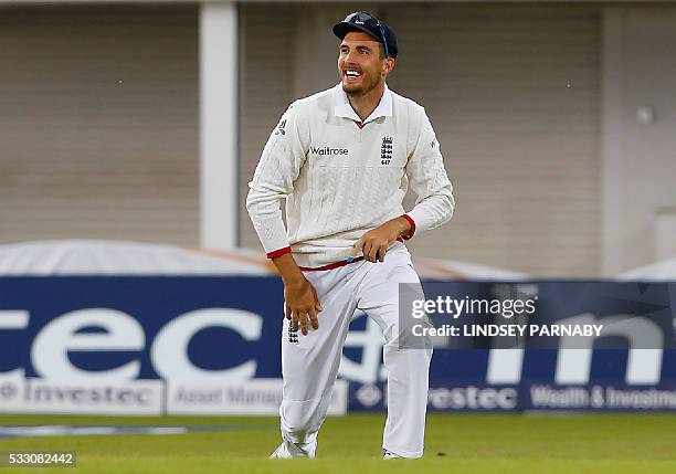 England's Steven Finn celebrates after catching the wicket of Sri Lanka's Dushmantha Chameera for 2 runs during play on the second day of the first...