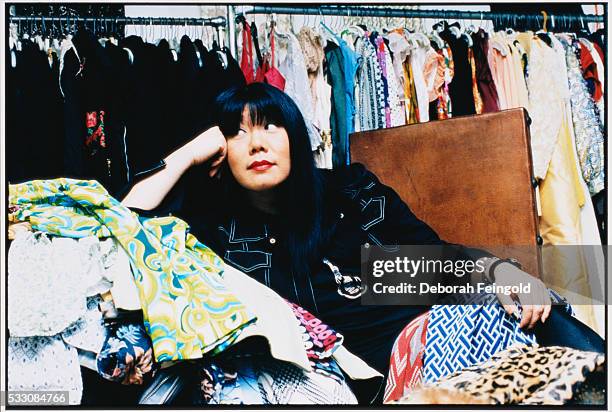 Deborah Feingold/Corbis via Getty Images) Anna Sui in a Pile of Her Fashions