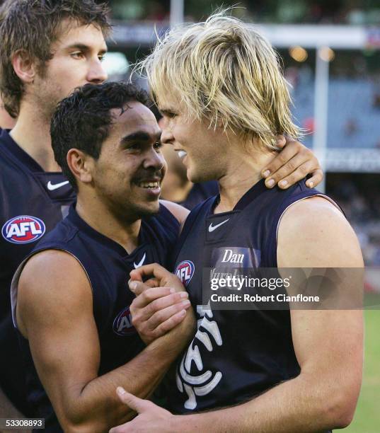 Eddie Betts and David Teague of the Blues celebrate after the Blues defeated the Tigers in the round 18 AFL match between the Carlton Blues and the...