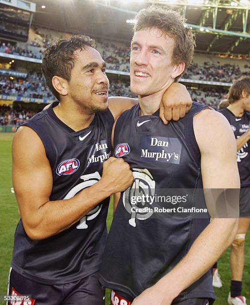 Eddie Betts of the Blues and Callum Chambers celebrate after the Blues defeated the Tigers in the round 18 AFL match between the Carlton Blues and...