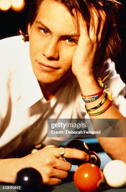 Deborah Feingold/Corbis via Getty Images) Actor Christian Slater with Eight Ball