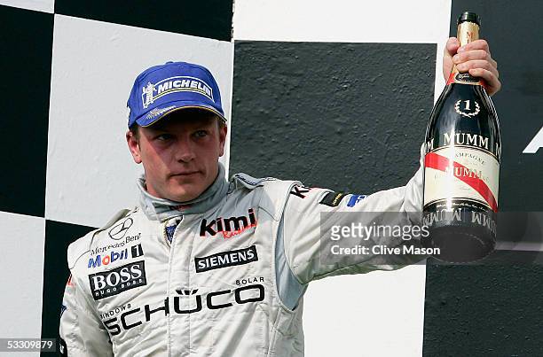 Kimi Raikkonen of Finland and McLaren Mercedes celebrates on the podium after winning the Hungarian F1 Grand Prix at the Hungaroring on July 31, 2005...