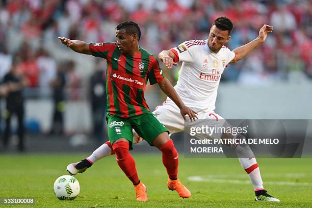 Benfica's Greek midfielder Andreas Samaris vies with Maritimo's Brazilian midfielder Eber Bessa during the Portuguese League Cup final football match...