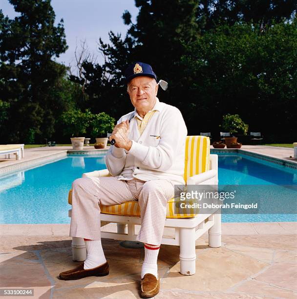 Deborah Feingold/Corbis via Getty Images) Bob Hope with Golf Club by Swimming Pool