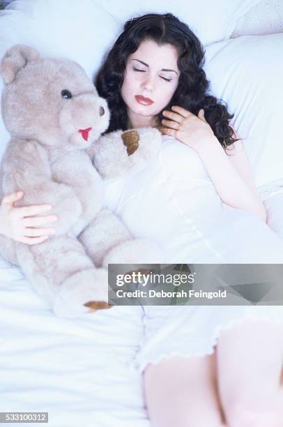 Deborah Feingold/Corbis via Getty Images) Actress Mia Kirshner with Teddy Bear