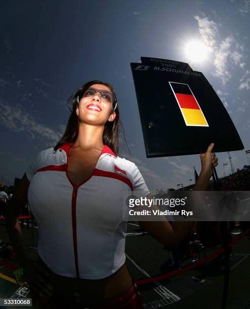 Grid girl smiles on on the starting grid prior to the the Hungarian F1 Grand Prix on July 31, 2005 in Budapest, Hungary.