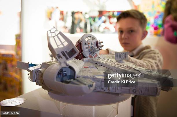 Joseph Irwin plays with The Millennium Falcon The Force Awakens figures at Dream toys 2015. Photos Ki Price