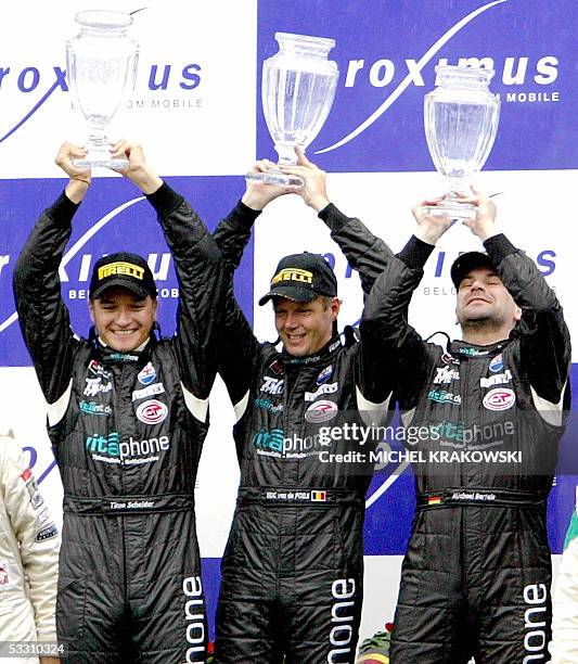 Francorchamps, BELGIUM: The winning Maserati team with German Timo Scheider, Belgian Eric Van de Poele and German Michael Bartels celebrate on the...