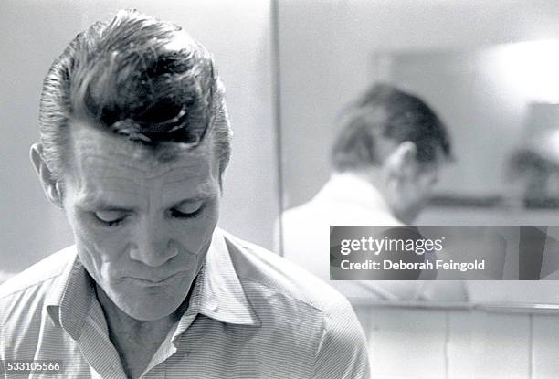 Deborah Feingold/Corbis via Getty Images) Chet Baker Beside Mirror