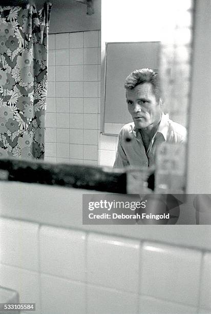 Deborah Feingold/Corbis via Getty Images) Chet Baker Looking Into Mirror