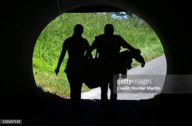 Samantha Richdale of Canada and her caddie walk through an under pass on their way to the ninth tee during the second round of the Kingsmill...