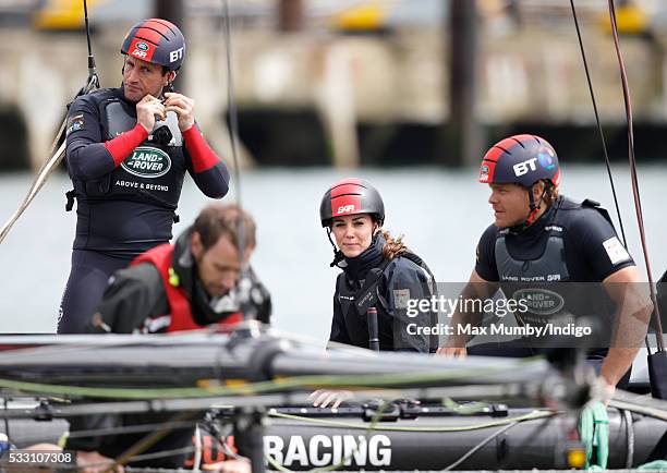 Catherine, Duchess of Cambridge and Sir Ben Ainslie on board a Land Rover BAR team training catamaran as they run a training circuit on the Solent on...