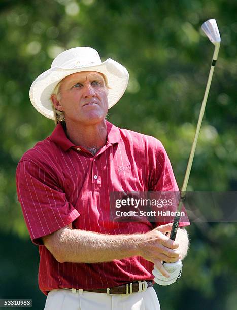 Greg Norman of Australia watches his tee shot to the second hole during the final round of the U.S. Senior Open at the NCR Country Club on July 31,...